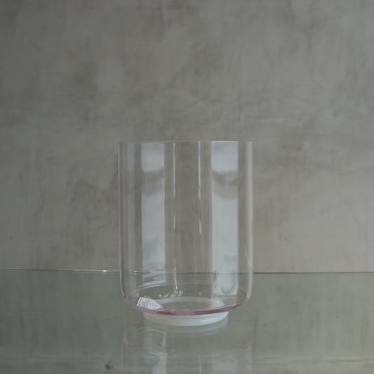 Crystal Tones 7-inch A-10 crystal singing bowl in Pink Aura Gold Tall and Therapeutic, side view on a glass shelf